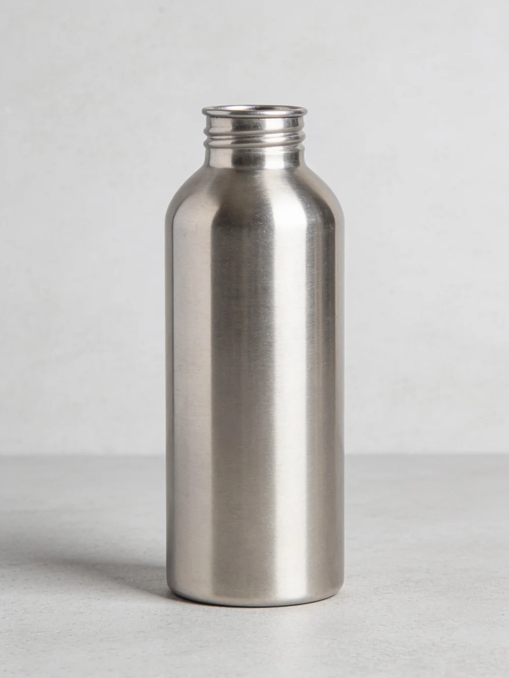 Wide-mouth steel bottle — Single-wall stainless steel; threaded steel cap with silicone seal