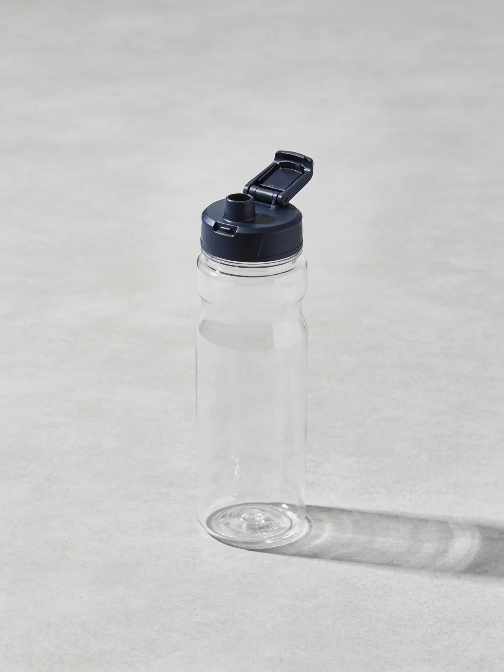 Flip-spout clear bottle — Clear copolyester body; polypropylene flip spout; silicone seal