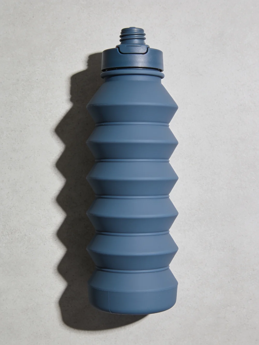 Collapsible silicone bottle — Accordion silicone body; polypropylene screw spout cap